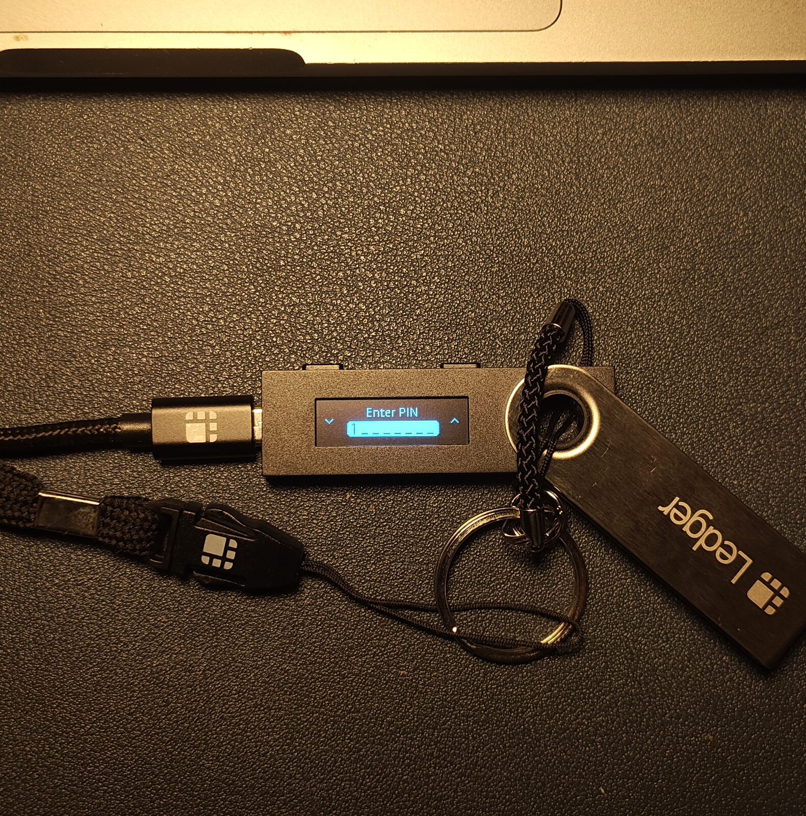 Ledger Nano S connected and displaying its PIN entry screen